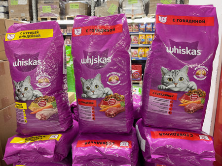 Novosibirsk, Siberia, Russia - December 02, 2023. Large packs of whiskey cat food in a supermarket. Whiskas is an international brand of pet cat food.のeditorial素材