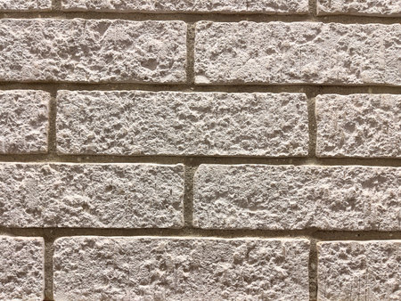Background of brick wall texture. Close-up. Vertical photo.
