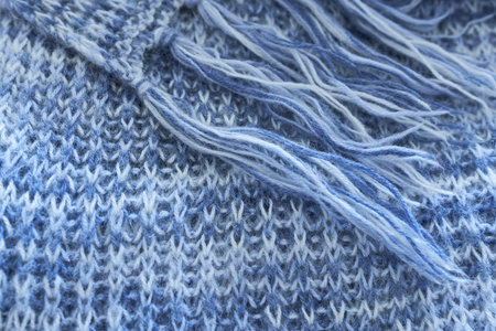 Close-up of knitted wool texture. Knitted wool background. Wool texture. Knitted scarf.