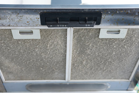 Dirty metal kitchen hood, lots of dust to be cleaned.の写真素材