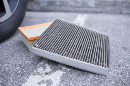 Car air filter on the floor in the parking lot, selective focusの写真素材