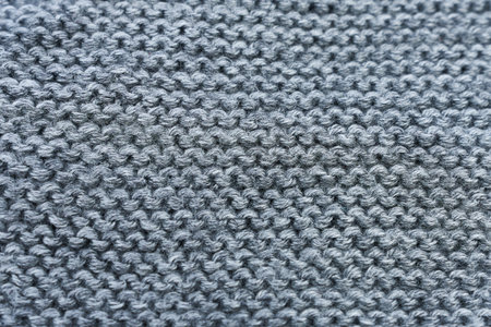 Close up of gray knitted fabric texture. Woolen background.の写真素材