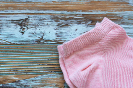 Pink cotton socks on a wooden background. Selective focus. nature.の写真素材
