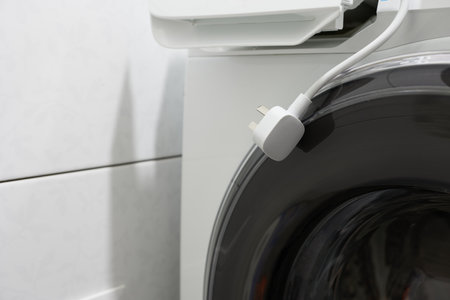 Electrical outlet in a washing machine, closeup of photo.の写真素材