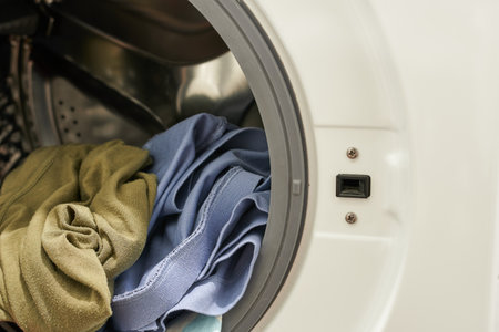 Washing machine with clothes in laundry room. Laundry conceptの写真素材