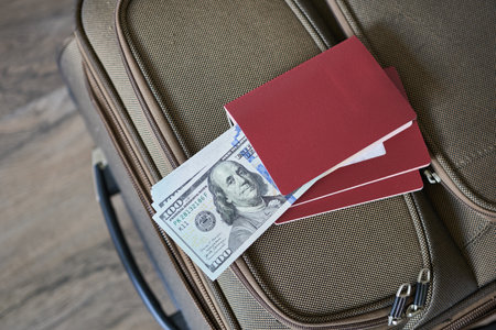 Dollars and passports on the suitcase. Going on holiday.の写真素材