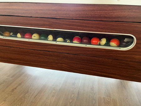 Billiard balls in a rack on a wooden table. Billiard concept
