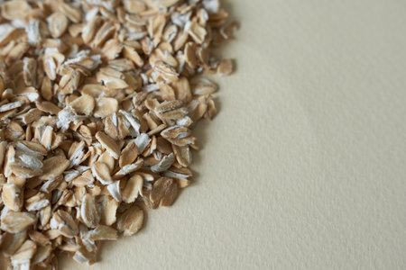 Oat flakes on white background, closeup. Healthy food conceptの写真素材