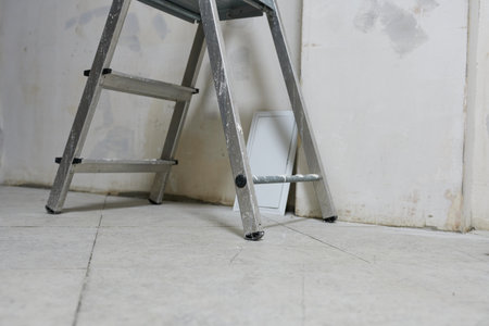 Ladder and socket on the floor in the room. Repair concept.の写真素材