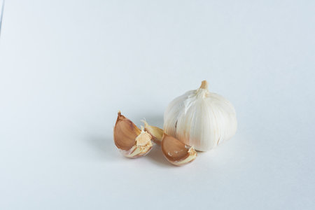 Garlic on a white background. Cloves and garlic cloves.の写真素材