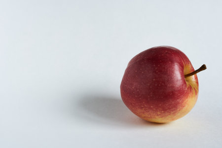 Red apple on a white background with copy space for your text.の写真素材