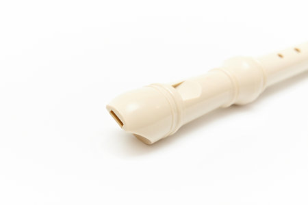 Front part of the recorder (flute) with a mouthpiece isolated on white backgroundの写真素材