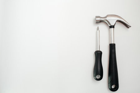 A wide range of household tools set on a white background: screwdriver and hammer. View from above. Home repairの写真素材