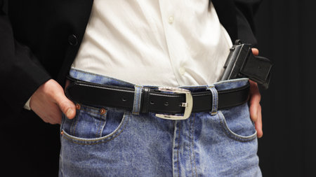 Businessman with a gun behind the belt.の写真素材
