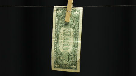 Dollar on clothesline as money laundering concept.の写真素材