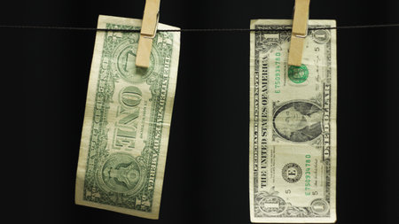 Dollars on clothesline as money laundering concept.の写真素材