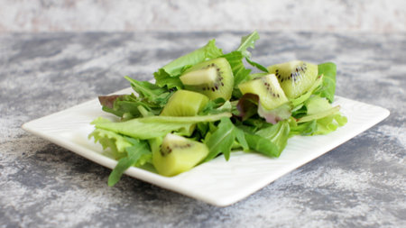 Fresh Salad Mix with Kiwi Slicesの写真素材
