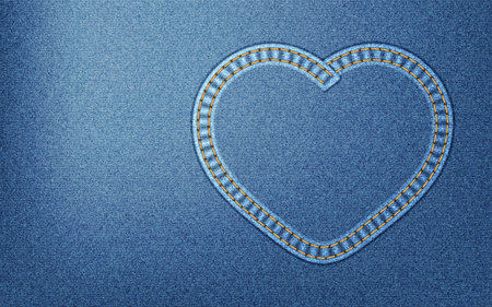 Realistic denim background with heart-shaped seamの写真素材
