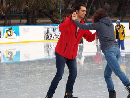 People skating on ice rink in Bucharest, Romania.のeditorial素材