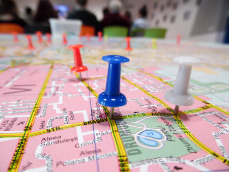 Pushpins marking locations on a road map