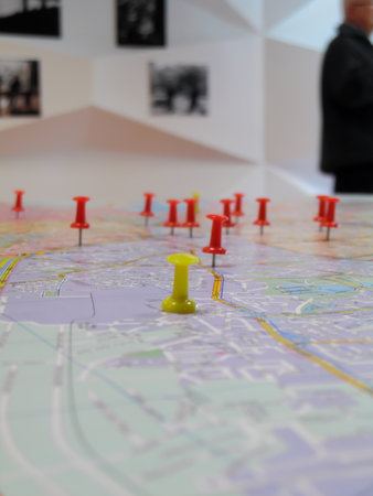 Pushpin marking a location on a road mapの写真素材