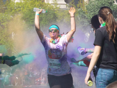 The Color Run. Close-up of marathon, people covered with colored powder.
