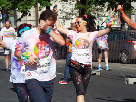The Color Run. Close-up of marathon, people covered with colored powder.