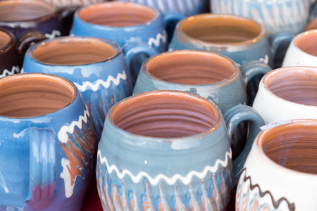 Colorful ceramic pottery on display to be soldの写真素材