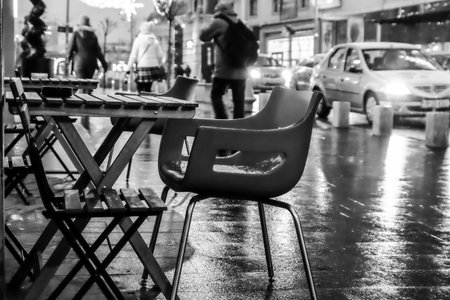 Sidewalk cafe. Cafe table and chairs on sidewalk.の写真素材