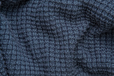 texture of knitting, creases, dark blue sweater