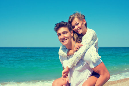 Couple having fun on the beachの写真素材