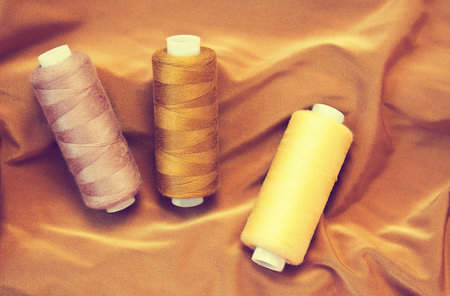 Various Sewing Accessories: colored threads, scissorsの写真素材