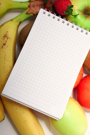 Healthy eating of diet meal plan with Workout and fitness dieting ,fitness and weight loss concept, fruit, Vegetable and notebook. Food and healthの写真素材