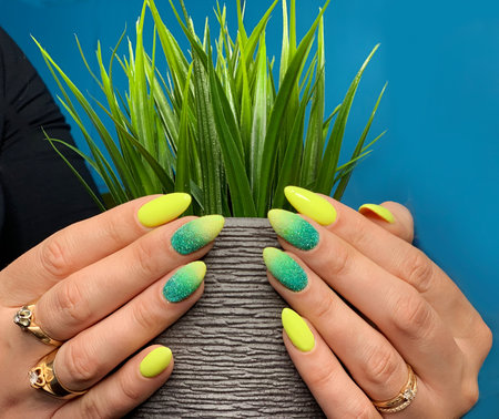 Women's well-groomed hands with a beautiful manicure. Taking care of yourself.の写真素材