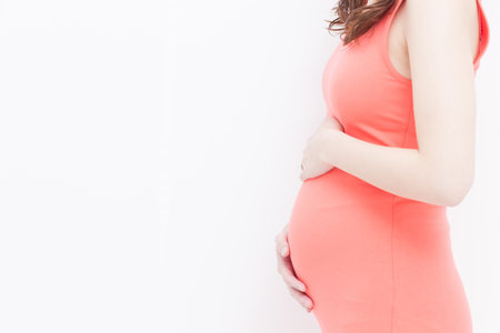 pregnant woman touching her belly の写真素材
