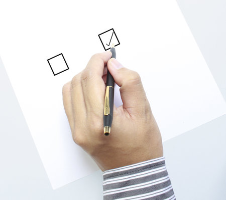 Hand with pen and check box の写真素材
