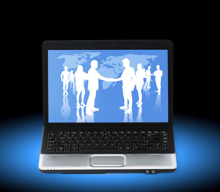 Silhouettes of business partners, Shake on a laptop の写真素材