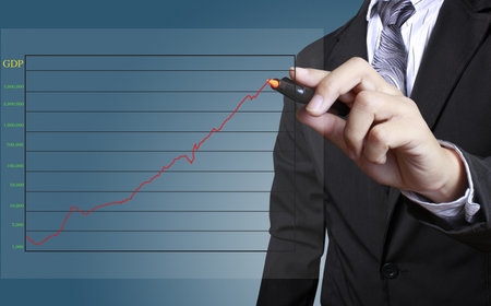 Male hand drawing a graph の写真素材