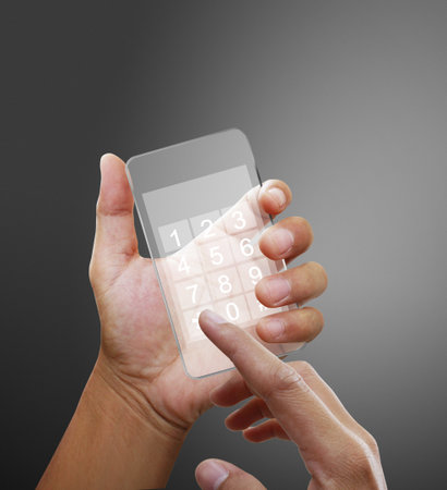 Hand holding smart phone の写真素材