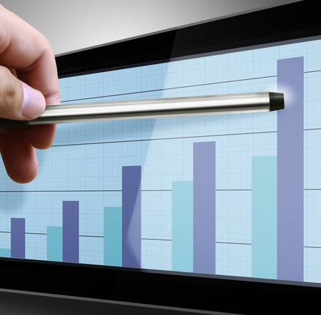 Pointing graph on computer monitor の写真素材