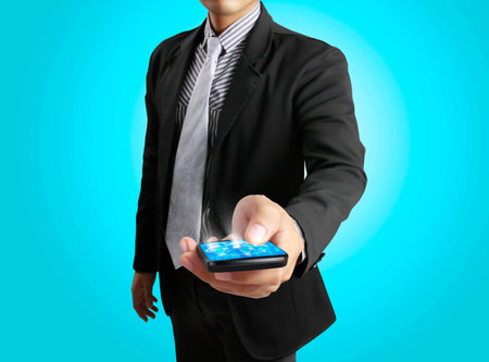Touch screen mobile phone with businessmenの写真素材