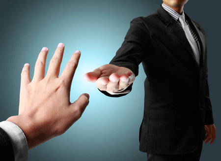 Helping hand in Business manの写真素材