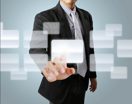 hand pushing on a touch screen interfaceの写真素材