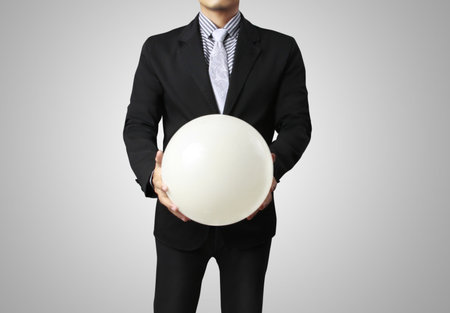 holding a glowing earth globe in his hands の写真素材