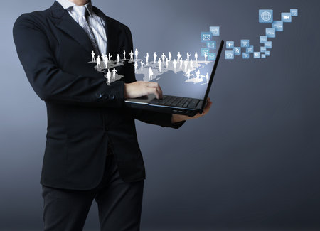 Businessman with laptop in his hands の写真素材