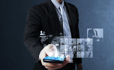 Touch screen mobile phone, in hand の写真素材