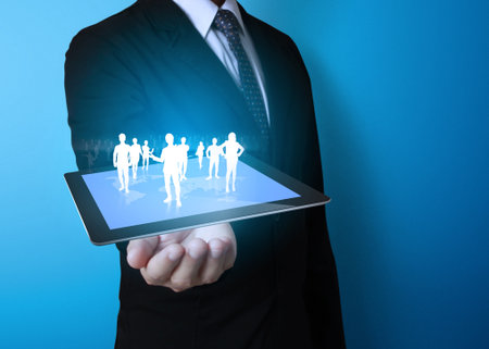 Technology in the hands of businessmen の写真素材