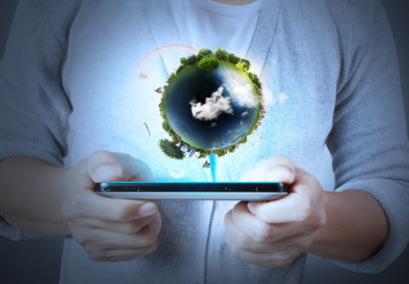 Touch screen mobile phone in hand with businessmen 