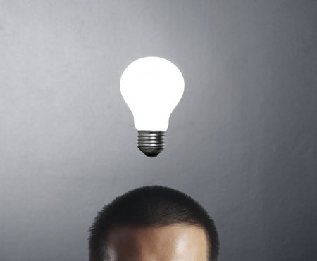 Businessman with and idea, drawn light bulb の写真素材