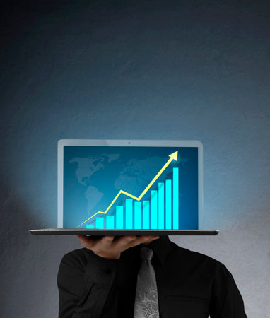 business man holding the laptopの写真素材